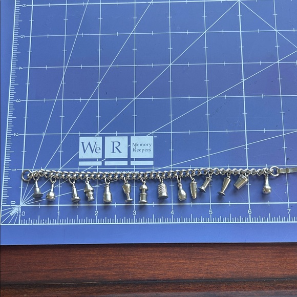 Enco Jewelry - Vintage Enco 14 charms bracelet 6.5” fold over closure brutalist silvertone EUC
